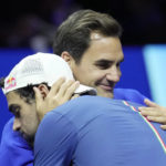 
              Team Europe's Matteo Berrettini, of Italy, celebrates with Roger Federer of Switzerland, after winning a match against Team World's Felix Auger-Aliassime, of Canada, on second day of the Laver Cup tennis tournament at the O2 in London, Saturday, Sept. 24, 2022. (AP Photo/Kin Cheung)
            