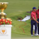 
              Billy Horschel, left, walks with Tony Finau after the USA team defeated the international team in match play at the Presidents Cup golf tournament at the Quail Hollow Club, Sunday, Sept. 25, 2022, in Charlotte, N.C. (AP Photo/Julio Cortez)
            