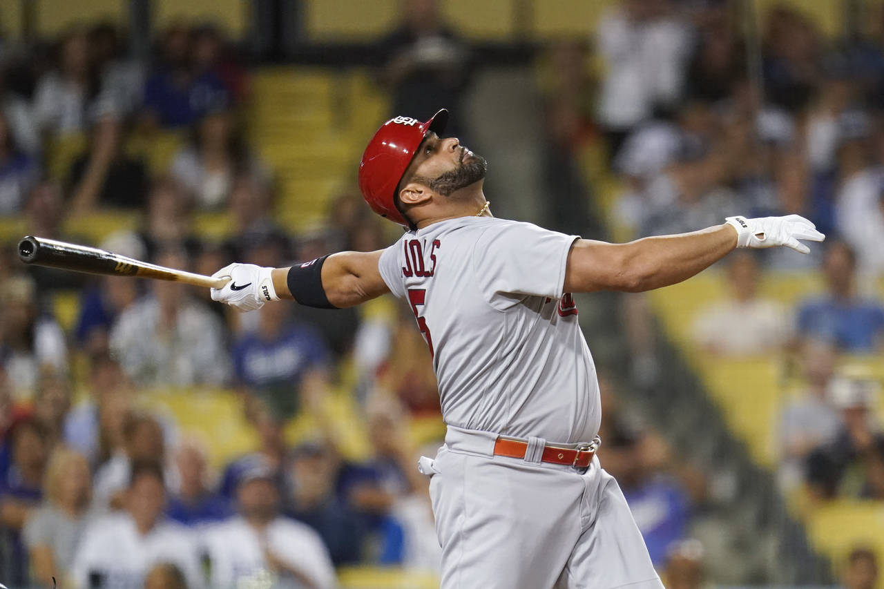 St. Louis Cardinals designated hitter Albert Pujols (5) hits a foul ball during the first inning of...