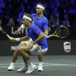 
              Team Europe's Roger Federer, front, and Rafael Nadal in action during their Laver Cup doubles match against Team World's Jack Sock and Frances Tiafoe at the O2 arena in London, Friday, Sept. 23, 2022. (AP Photo/Kin Cheung)
            
