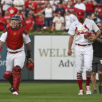 
              St. Louis Cardinals' Yadier Molina, left, and Adam Wainwright walk in from the bullpen after warming up for the team's baseball game against the Milwaukee Brewers on Wednesday Sept. 14, 2022, in St. Louis. (AP Photo/Joe Puetz)
            