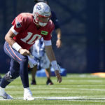 
              New England Patriots quarterback Mac Jones warms up during an NFL football practice, Wednesday, Sept. 14, 2022, in Foxborough, Mass. (AP Photo/Steven Senne)
            