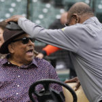 
              Hall of Fame player Orlando Cepeda, left, smiles as he talks with former San Francisco Giants player Tito Fuentes before a baseball game between the Giants and the Los Angeles Dodgers in San Francisco, Saturday, Sept. 17, 2022. (AP Photo/Jeff Chiu)
            