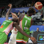 
              Mali's Sika Kone, left, is hit in the face by the ball when playing Serbia during their game at the women's Basketball World Cup in Sydney, Australia, Monday, Sept. 26, 2022. (AP Photo/Rick Rycroft)
            
