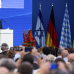 
              Israeli President Isaac Herzog delivers his speech during a ceremony to commemorate the victims of the attack by Palestinian militants on the 1972 Munich Olympics in Fuerstenfeldbruck near Munich, Germany, Monday, Sept. 5, 2002. The German and Israeli presidents are to join relatives of the 11 Israeli athletes killed in the attack by Palestinian militants on the commemoration event marking the 50th anniversary of the attack. (Sven Hoppe/dpa via AP)
            