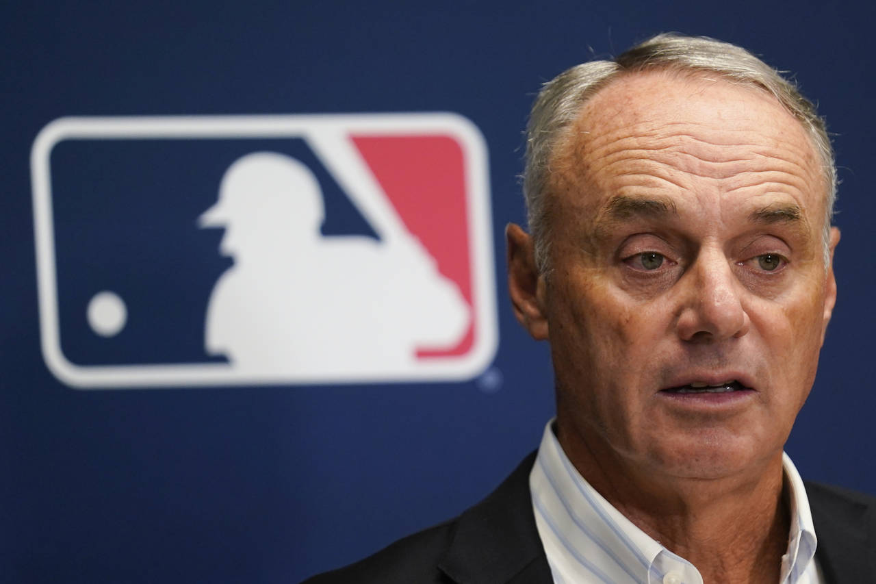 FILE - Major League Baseball Commissioner Rob Manfred speaks to reporters following an owners' meet...