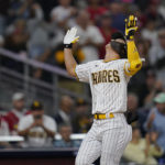 
              San Diego Padres' Ha-Seong Kim reacts after hitting a home run during the fourth inning of the team's baseball game against the St. Louis Cardinals, Tuesday, Sept. 20, 2022, in San Diego. (AP Photo/Gregory Bull)
            