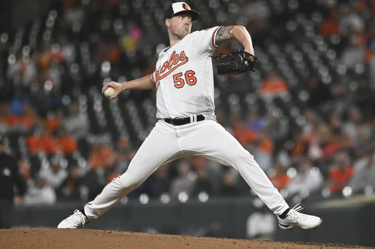Baltimore Orioles starting pitcher Kyle Bradish (56) throws during the fifth inning of the team's b...