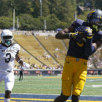
              California wide receiver Jeremiah Hunter (3) catches a three-yard touchdown against UC Davis during the first half of an NCAA college football game in Berkeley, Calif., Saturday, Sept. 3, 2022. (AP Photo/Godofredo A. Vásquez)
            