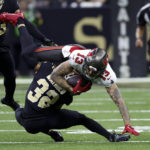 
              Tampa Bay Buccaneers wide receiver Mike Evans is tackled by New Orleans Saints safety Tyrann Mathieu during the first half of an NFL football game in New Orleans, Sunday, Sept. 18, 2022. (AP Photo/Butch Dill)
            