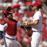 
              St. Louis Cardinals catcher Yadier Molina, left, talks to starting pitcher Adam Wainwright during the fifth inning of a baseball game against the Washington Nationals Thursday, Sept. 8, 2022, in St. Louis. (AP Photo/Jeff Roberson)
            