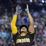 
              San Diego Padres' Juan Soto celebrates after his home run against the Arizona Diamondbacks during the fifth inning of a baseball game in Phoenix, Sunday, Sept. 18, 2022. (AP Photo/Ross D. Franklin)
            