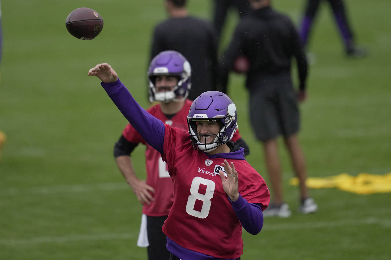 Minnesota Vikings quarterback Kirk Cousins passes the ball during a practice session in Thundridge,...