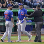 
              Chicago Cubs' Patrick Wisdom, center, has words for Pittsburgh Pirates relief pitcher Duane Underwood Jr. as he walks to first base after being hit by a pitch during the seventh inning of a baseball game in Pittsburgh, Sunday, Sept. 25, 2022. (AP Photo/Gene J. Puskar)
            