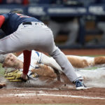 
              Boston Red Sox pitcher Matt Strahm tags out Tampa Bay Rays' Taylor Walls as he tries to score from second base on a wild pitch during the seventh inning of a baseball game Wednesday, Sept. 7, 2022, in St. Petersburg, Fla. (AP Photo/Chris O'Meara)
            
