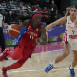 
              United States' Kahleah Copper tries to get the ball past Puerto Rico's Zaida Gonzalez at the women's Basketball World Cup in Sydney, Australia, Friday, Sept. 23, 2022. (AP Photo/Mark Baker)
            