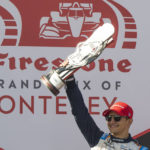 
              Chip Ganassi Racing driver Álex Palou, of Spain, celebrates after winning the IndyCar season finale auto race at Laguna Seca Raceway on Sunday, Sept. 11, 2022, Monterey, Calif. (AP Photo/Nic Coury)
            