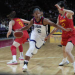 
              United States' Alyssa Thomas pushes past China's Pan Zhenqi, right, during their game at the women's Basketball World Cup in Sydney, Australia, Saturday, Sept. 24, 2022. (AP Photo/Mark Baker)
            