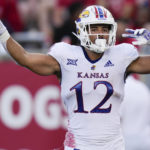 
              Kansas running back Torry Locklin celebrates after his touchdown during the first half of an NCAA college football game against Houston, Saturday, Sept. 17, 2022, in Houston. (AP Photo/Eric Christian Smith)
            