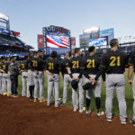
              Members of the Pittsburgh Pirates, wearing No. 21 for Roberto Clemente, stand for the national anthem before a baseball game against the New York Mets on Thursday, Sept. 15, 2022, in New York. (AP Photo/Adam Hunger)
            