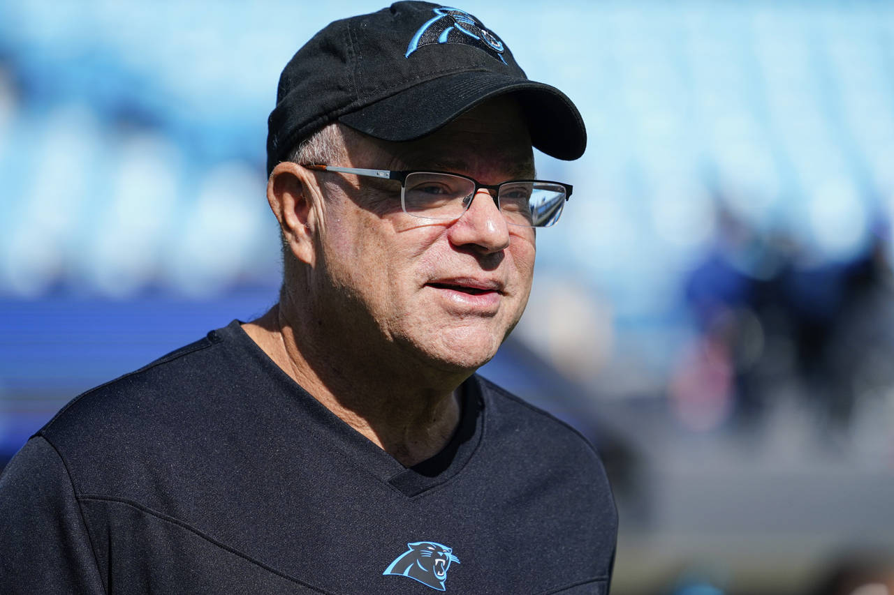 FILE - Carolina Panthers team owner David Tepper looks on before an NFL football game against the M...
