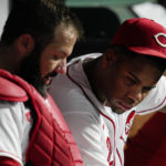 
              Cincinnati Reds starting pitcher Hunter Greene, right, sits in the dugout with catcher Austin Romine during the fifth inning of the team's baseball game against the Milwaukee Brewers on Thursday, Sept. 22, 2022, in Cincinnati. (AP Photo/Jeff Dean)
            