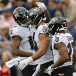 
              Baltimore Ravens tight end Mark Andrews, center, celebrates after his touchdown with wide receiver Demarcus Robinson, left, and running back J.K. Dobbins, right, in the first half of an NFL football game against the New England Patriots, Sunday, Sept. 25, 2022, in Foxborough, Mass. (AP Photo/Michael Dwyer)
            