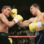 
              FILE - Erik Morales, left, of Mexico, and Marco Antonio Barrera, of Mexico, trade punches in the 11th round of their WBC super featherweight title fight on Nov. 27, 2004, at the MGM Grand Garden Arena in Las Vegas. The two Mexican greats gave their all in three bouts over nearly five years, providing the defining moments of both fighters' careers.(AP Photo/Mark J. Terrill, File)
            