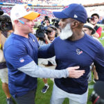 
              Denver Broncos head coach Nathaniel Hackett, left, greets Houston Texans head coach Lovie Smith after an NFL football game, Sunday, Sept. 18, 2022, in Denver. The Broncos defeated the Texans 16-9. (AP Photo/Jack Dempsey)
            