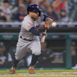 
              Houston Astros' Jose Altuve bunts for a single in the fourth inning of a baseball game against the Detroit Tigers in Detroit, Tuesday, Sept. 13, 2022. (AP Photo/Paul Sancya)
            