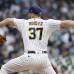 
              Milwaukee Brewers' Adrian Houser pitches during the first inning of a baseball game against the Cincinnati Reds Saturday, Sept. 10, 2022, in Milwaukee. (AP Photo/Aaron Gash)
            