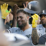 
              Chicago White Sox's Yoán Moncada celebrates with teammates in the dugout after hitting a three-run home run against the Oakland Athletics during the second inning of a baseball game in Oakland, Calif., Thursday, Sept. 8, 2022. (AP Photo/Godofredo A. Vásquez)
            