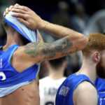 
              Italy's Achille Polonara, left, reacts after the Eurobasket quarter final basketball match between France and Italy in Berlin, Germany, Wednesday, Sept. 14, 2022. France defeated Italy by 93-85. (AP Photo/Michael Sohn)
            