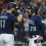 
              Seattle Mariners' Mitch Haniger, left, is congratulated by Eugenio Suarez after hitting a two-run home run off Texas Rangers starting pitcher Jon Gray during the first inning of a baseball game Thursday, Sept. 29, 2022, in Seattle. (AP Photo/Stephen Brashear)
            