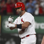
              St. Louis Cardinals' Albert Pujols gestures after hitting an RBI double against the Milwaukee Brewers during the eighth inning of a baseball game Wednesday Sept. 14, 2022, in St. Louis. (AP Photo/Joe Puetz)
            