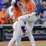 
              Houston Astros' Alex Bregman, left, and Jeremy Pena (3) celebrate a home run by Pena against the Los Angeles Angels during the sixth inning of a baseball game Friday, Sept. 9, 2022, in Houston. (AP Photo/Michael Wyke)
            
