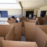 
              FILE - Movers sorts boxes for packing at the Los Angeles Chargers' facility after NFL football minicamp, Thursday, June 15, 2017, in San Diego. Finding a home on and off the field can be an overwhelming chore for many NFL players. Especially in a topsy-turvy league where job security is far from guaranteed. (AP Photo/Denis Poroy, File)
            