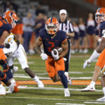 
              Illinois running back Chase Brown breaks into the open during the first half of the team's NCAA college football game against Chattanooga on Thursday, Sept. 22, 2022, in Champaign, Ill. (AP Photo/Charles Rex Arbogast)
            