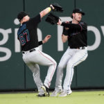 
              Miami Marlins center fielder JJ Bleday (67) avoids right fielder Brian Anderson, right, as he catches a fly ball from Atlanta Braves' Robbie Grossman in the third inning of a baseball game Friday, Sept. 2, 2022, in Atlanta. (AP Photo/John Bazemore)
            