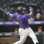 
              Colorado Rockies catcher Elias Diaz watches his game-ending, three-run home run off Arizona Diamondbacks relief pitcher Caleb Smith during the ninth inning of a baseball game Friday, Sept. 9, 2022, in Denver. (AP Photo/David Zalubowski)
            