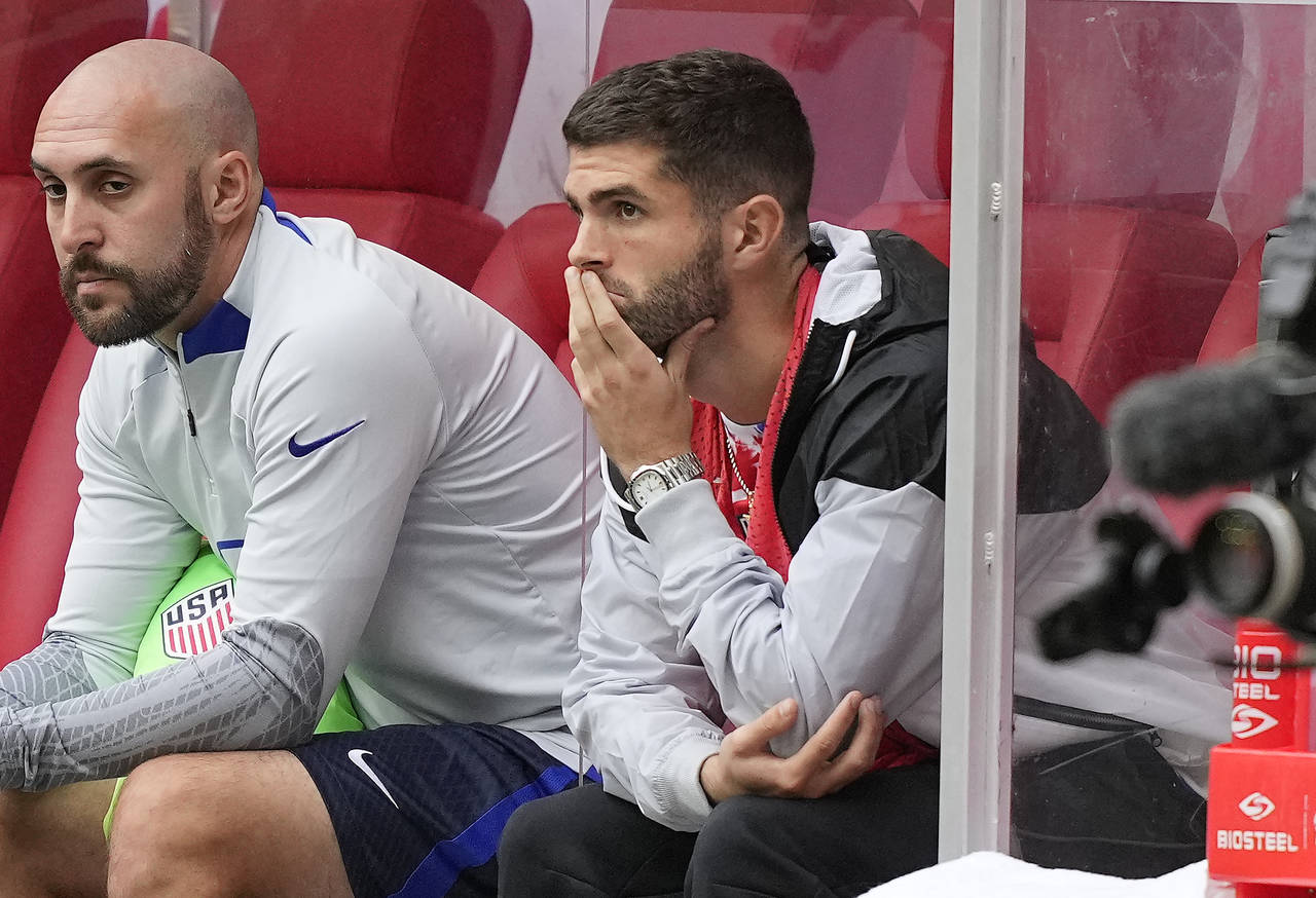Christian Pulisic follows the game from the bench during the international friendly soccer match be...