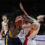 
              Bosnia and Herzegovina's Jonquel Jones, left, collides with China's Zhang Ruduring their game at the women's Basketball World Cup in Sydney, Australia, Friday, Sept. 23, 2022. (AP Photo/Mark Baker)
            