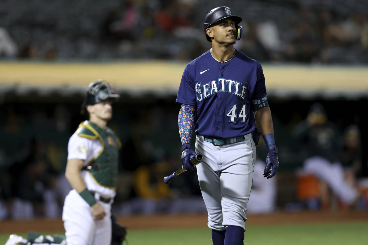 Seattle Mariners' Julio Rodriguez (44) walks back to the dugout after striking out against the Oakl...
