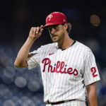 
              Philadelphia Phillies pitcher Aaron Nola acknowledges the crowd as he walks off the field after being pulled during the seventh inning of a baseball game against the Miami Marlins, Tuesday, Sept. 6, 2022, in Philadelphia. (AP Photo/Matt Slocum)
            