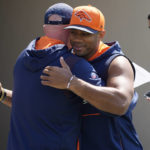 
              Denver Broncos head coach Nathaniel Hackett, left, hugs quarterback Russell Wilson as he heads to a news conference before the NFL football team's practice Thursday, Sept. 8, 2022, at the Broncos' headquarters in Centennial, Colo. The Broncos open the NFL season Monday night against the Seahawks in Seattle. (AP Photo/David Zalubowski)
            