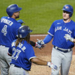 
              Toronto Blue Jays' Matt Chapman, right, George Springer (4), and Vladimir Guerrero Jr. (27), celebrate after scoring on a double by Bo Bichette during the seventh inning of the team's baseball game against the Pittsburgh Pirates, Saturday, Sept. 3, 2022, in Pittsburgh. (AP Photo/Keith Srakocic)
            