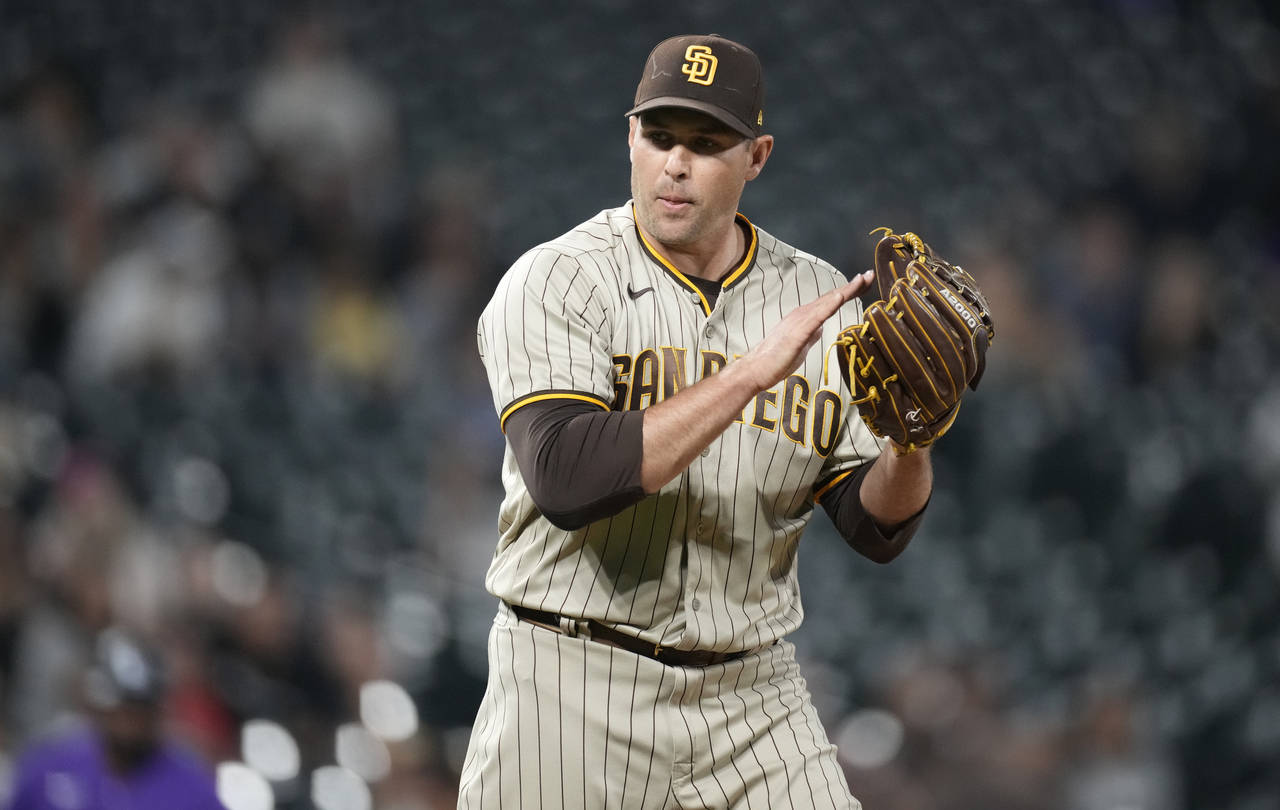 San Diego Padres relief pitcher Craig Stammen reacts after getting Colorado Rockies' Brian Serven t...