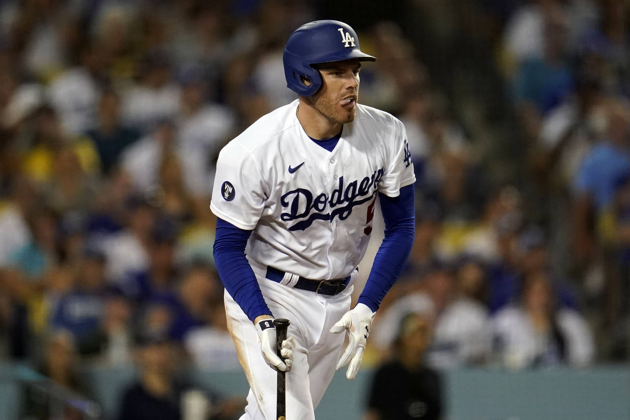 Los Angeles Dodgers' Freddie Freeman reacts after hitting an RBI-single during the sixth inning of ...