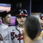 
              Atlanta Braves' Austin Riley is congratulated after hitting a solo home run in the fourth inning of a baseball game against the Miami Marlins, Saturday, Sept. 3, 2022, in Atlanta. (AP Photo/Bob Andres)
            