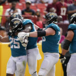 
              Jacksonville Jaguars running back James Robinson (25) celebrates his touchdown against the Washington Commanders during the second half of an NFL football game, Sunday, Sept. 11, 2022, in Landover, Md. (AP Photo/Alex Brandon)
            